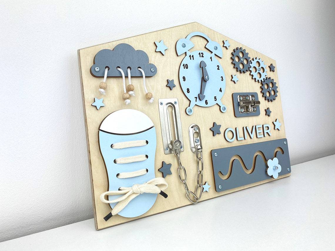 House shaped wooden busy board side view