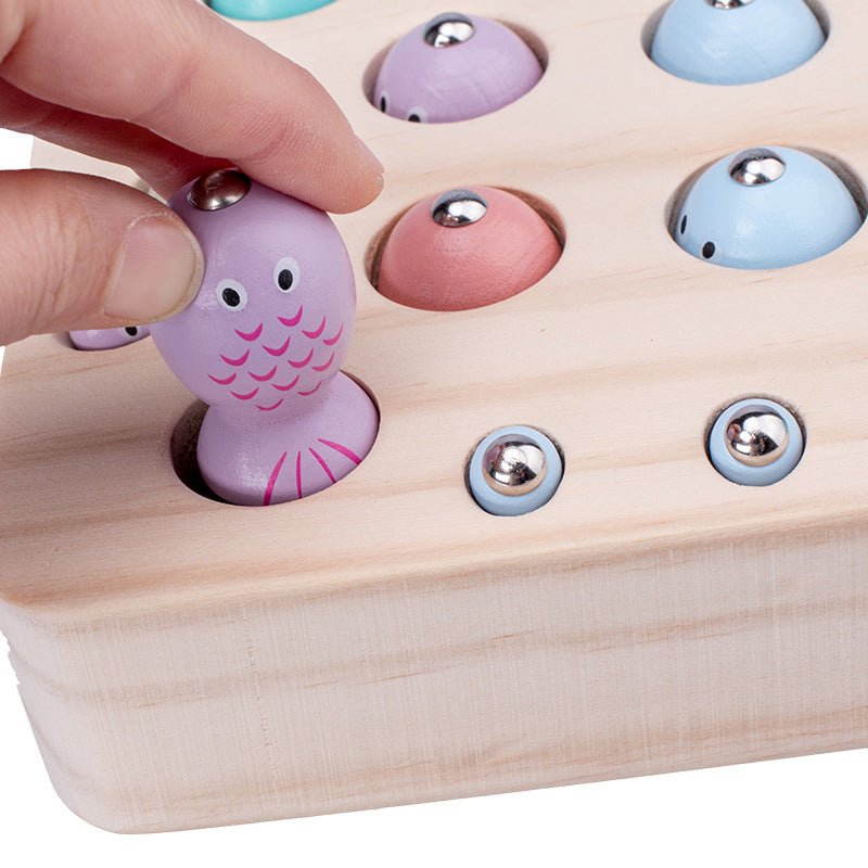 Magnetic fish and worm catching game close-up of a fish in the board