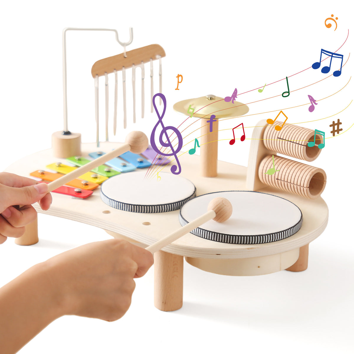 Child playing the wooden musical activity table