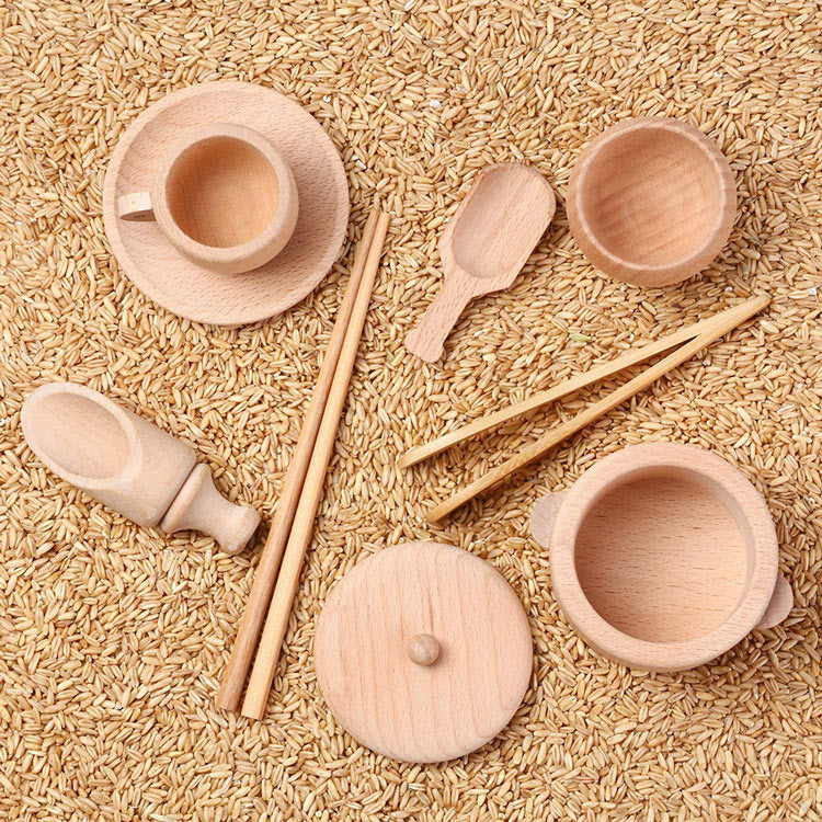 Wooden sensory bin tool set on oats for sensory play