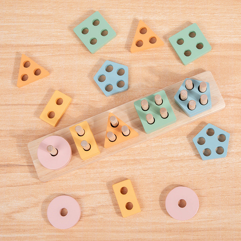 Pastel wooden shape stacker pieces laid out on wood