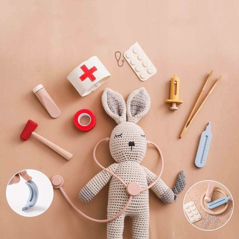Wooden doctor kit pieces with a crochet bunny