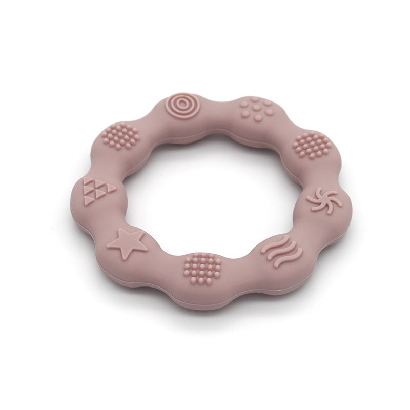 Silicone textured ring teether in light pink