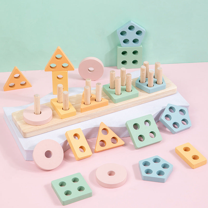 Pastel wooden shape stacker with loose pieces on pink background
