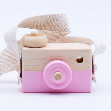 Pink wooden toy camera with cotton strap