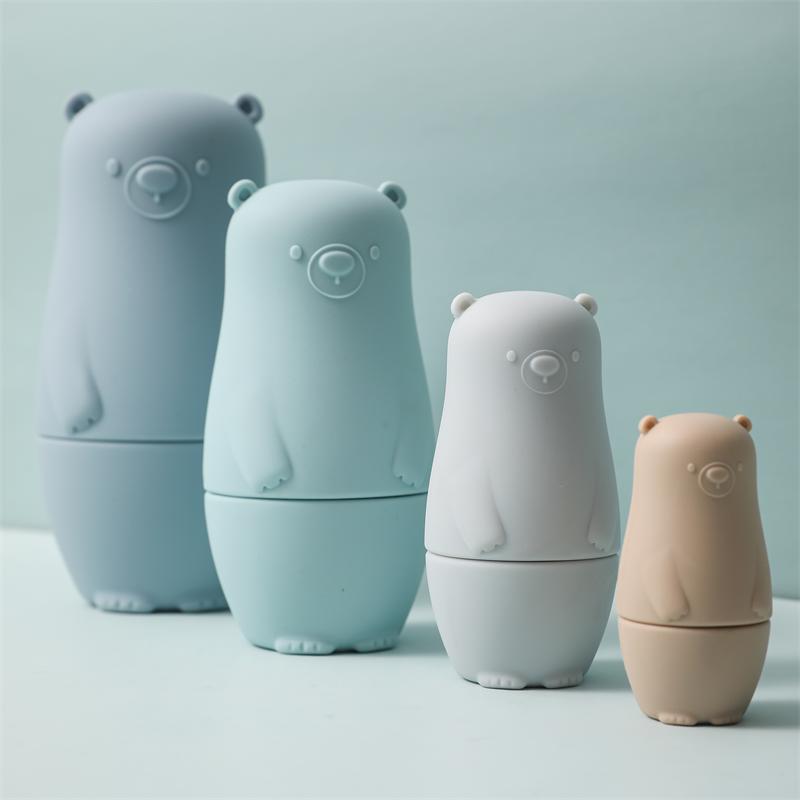 Blue silicone bear nesting dolls lined up by size