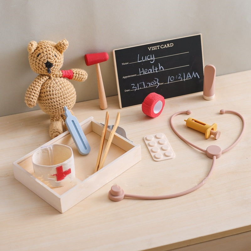 Wooden doctor kit in its wooden case with a teddy