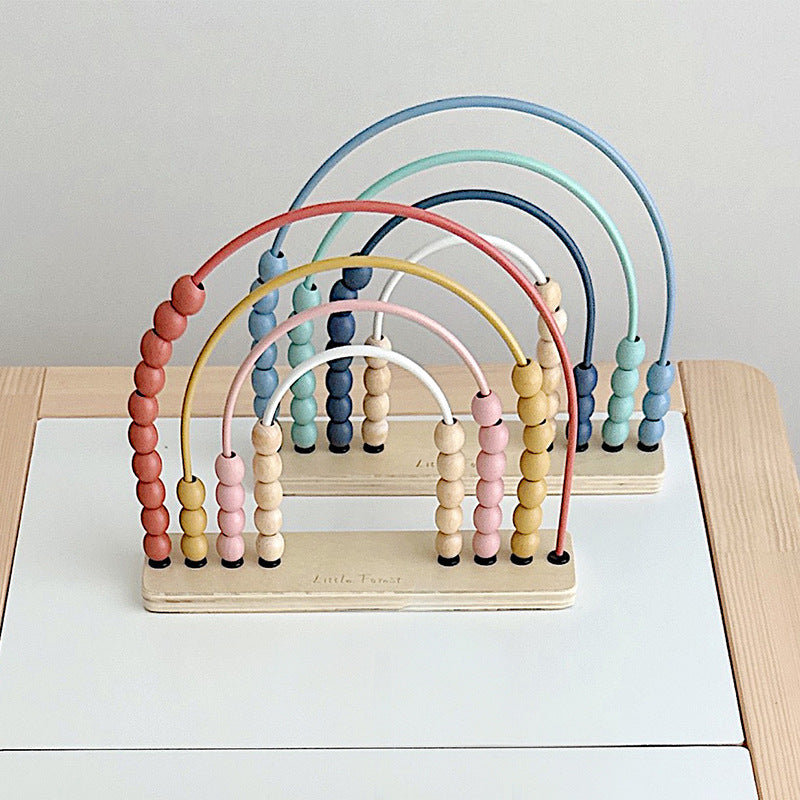 Blue and pink wooden rainbow abacus together