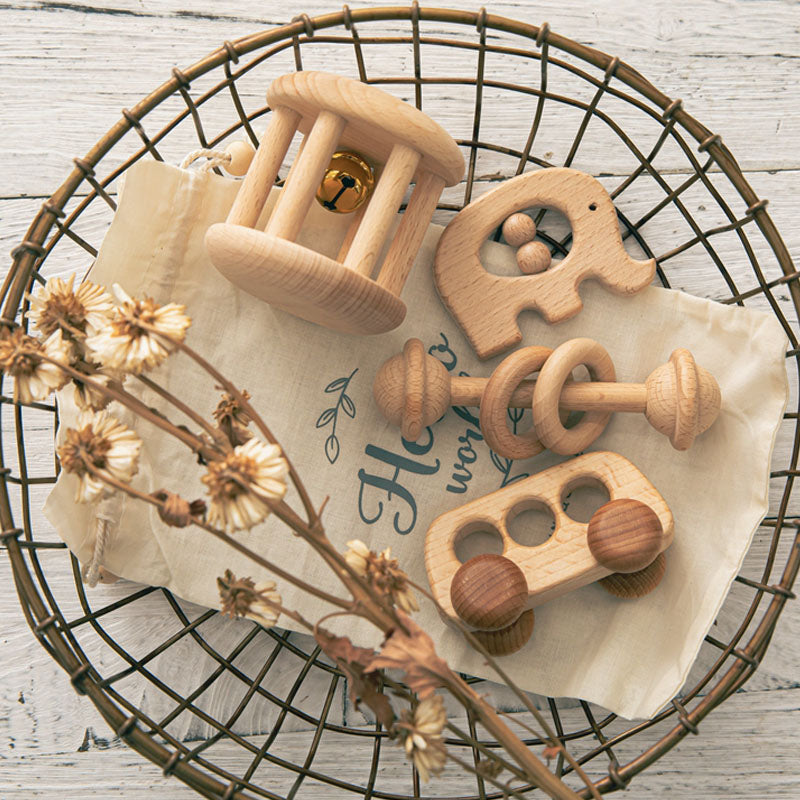 Wooden rattle set with elephant teether in a wire basket