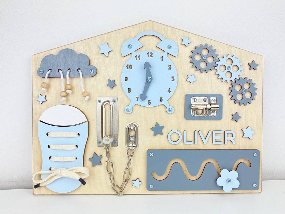 House shaped wooden busy board front view