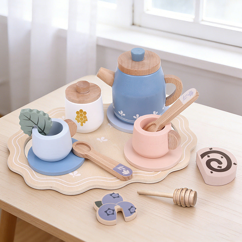 Blue wooden tea set on a play table