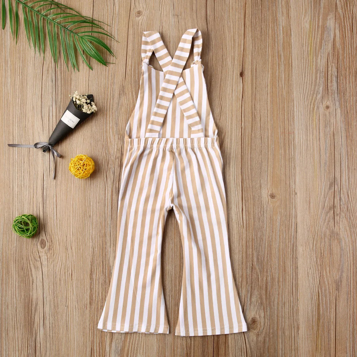 BabyLove Sleeveless Striped Romper at BubeBaby, perfect for baby girls from 0-5 years. Made from a comfy cotton-polyester blend, this versatile romper features a square collar, covered button closure, and short sleeves, ideal for all seasons. 