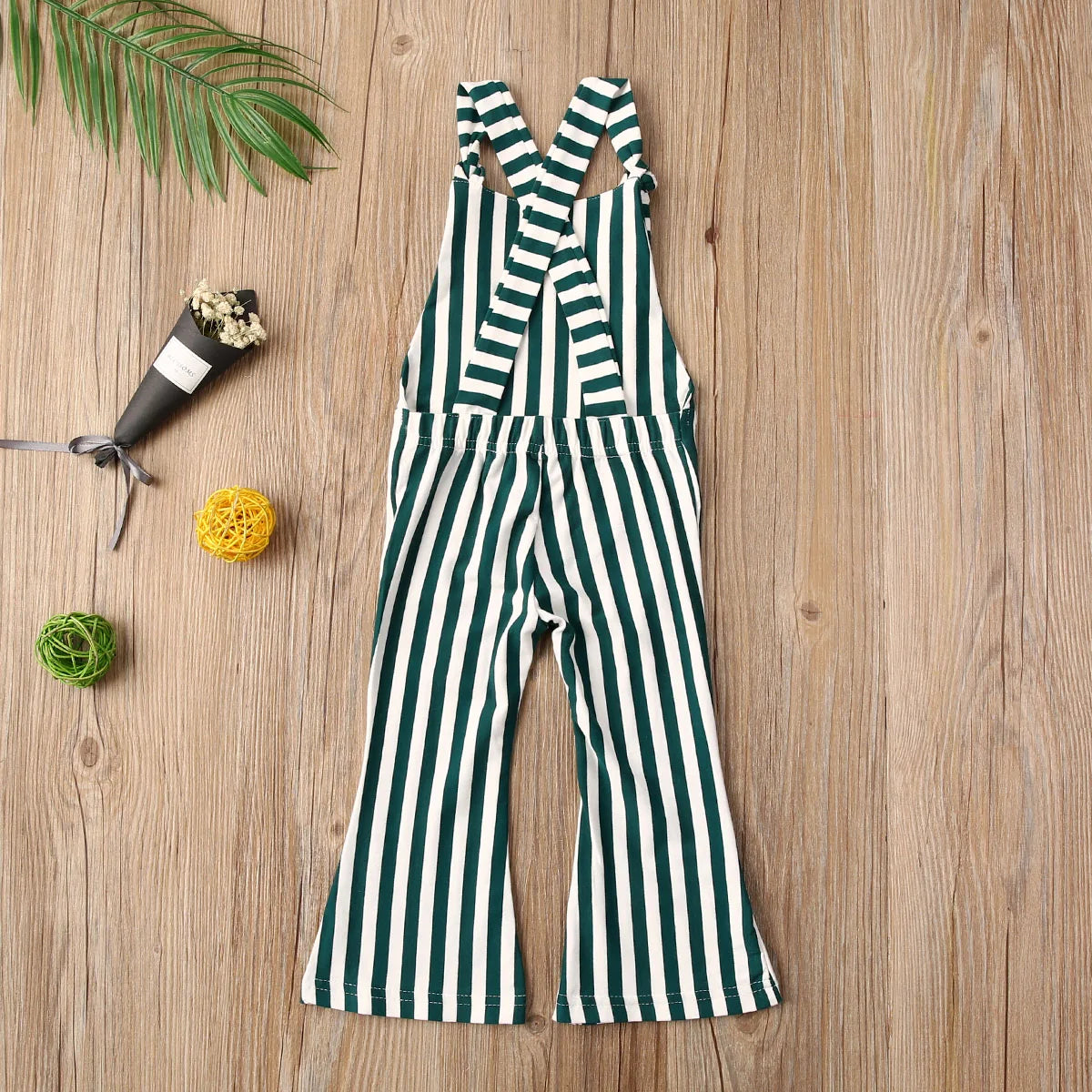 BabyLove Sleeveless Striped Romper at BubeBaby, perfect for baby girls from 0-5 years. Made from a comfy cotton-polyester blend, this versatile romper features a square collar, covered button closure, and short sleeves, ideal for all seasons. 