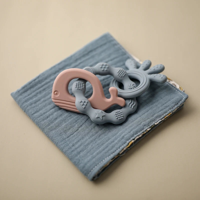 Introducing our Bubebaby Babylove Teether Bracelet, crafted from safe, BPA-free silicone, ideal for ages 0-36 months. This latex, nitrosamine, and phthalate-free teether offers effective tooth care in a fun, cartoon whimsical shape. Available in various colors and sizes, it comes conveniently bagged or boxed for easy gifting.