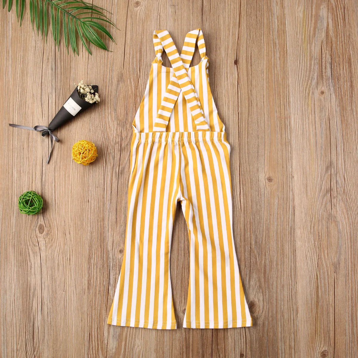 BabyLove Sleeveless Striped Romper at BubeBaby, perfect for baby girls from 0-5 years. Made from a comfy cotton-polyester blend, this versatile romper features a square collar, covered button closure, and short sleeves, ideal for all seasons. 
