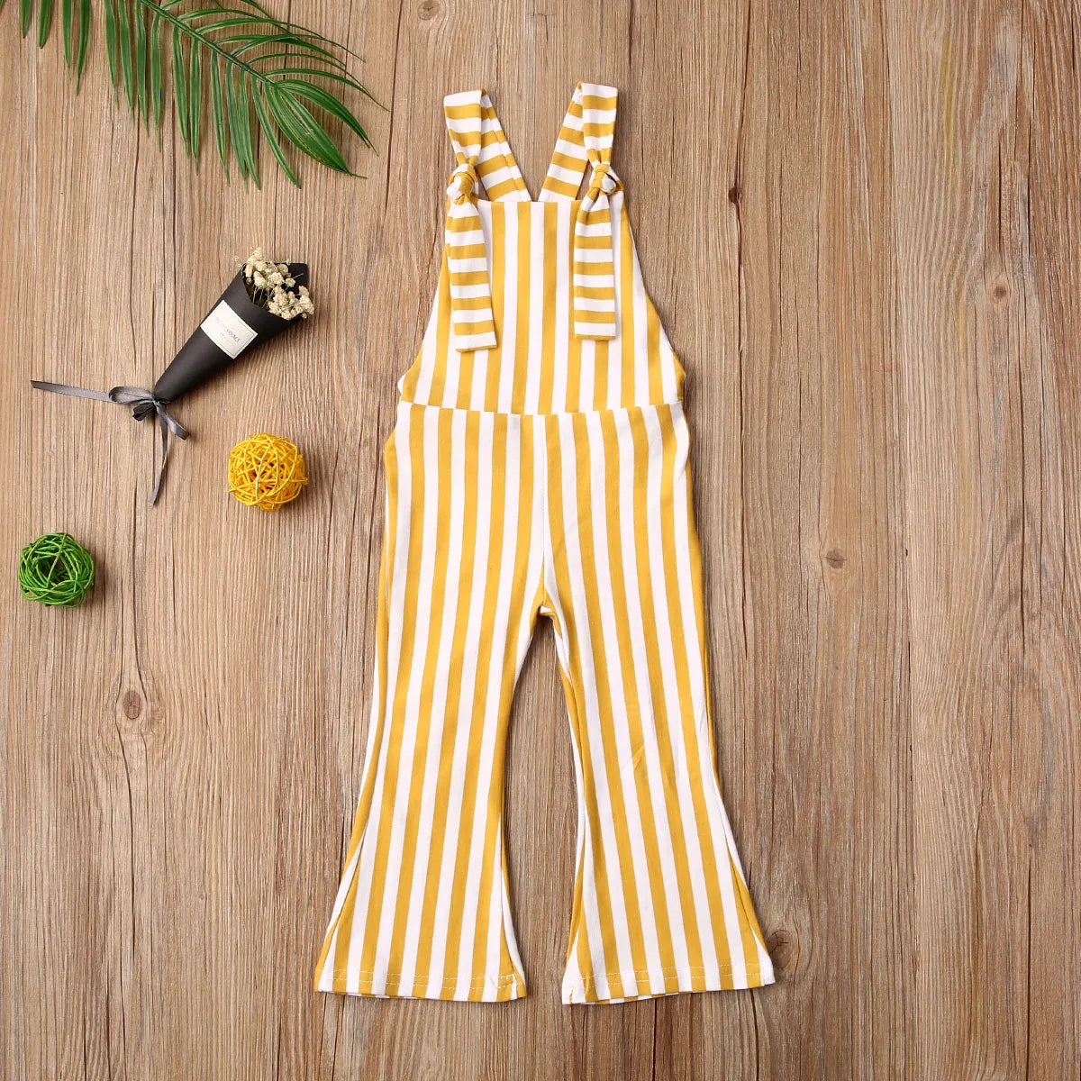 BabyLove Sleeveless Striped Romper at BubeBaby, perfect for baby girls from 0-5 years. Made from a comfy cotton-polyester blend, this versatile romper features a square collar, covered button closure, and short sleeves, ideal for all seasons. 