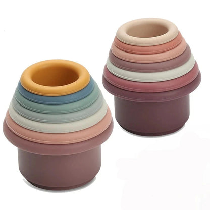 Discover the Montessori Silicone Stacking Cups at BubeBaby. Made from durable ABS, these versatile cups are perfect for beach, bath, and indoor play. Packaged in a net bag, they offer endless fun . Ideal for sensory play and skill development