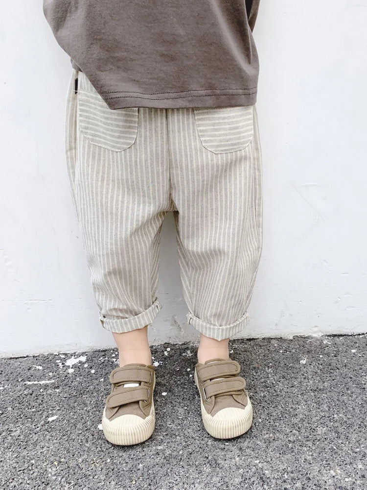 BabyLove Bubebaby Unisex cotton harem pants for children aged 4-6 years. Featuring a striped pattern, elastic waist, and pockets, these regular-fit pants are perfect for all seasons. True to size with a mid-waist design, offering comfort and style for any occasion