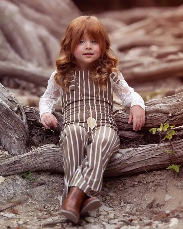 BabyLove Sleeveless Striped Romper at BubeBaby, perfect for baby girls from 0-5 years. Made from a comfy cotton-polyester blend, this versatile romper features a square collar, covered button closure, and short sleeves, ideal for all seasons. 