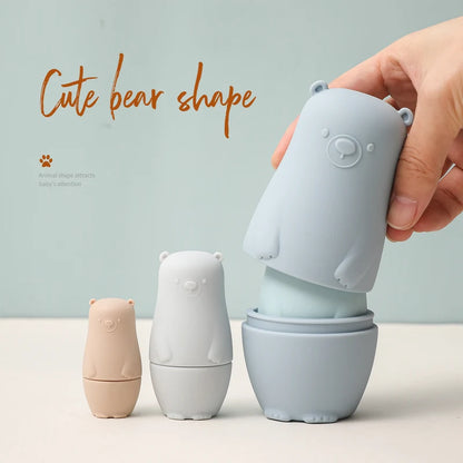 Montessori Silicone Bear Matryoshka Toy: A set of soft, stackable, bear-shaped nesting dolls in various sizes, made from pastel-colored, food-grade silicone. The bears fit inside one another, designed to encourage fine motor skills, sensory exploration, and cognitive development in young children