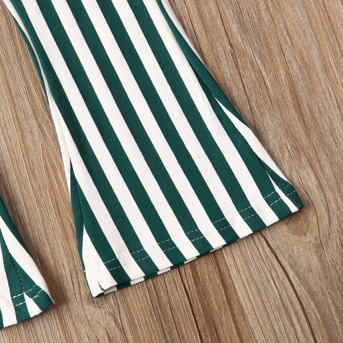 BabyLove Sleeveless Striped Romper at BubeBaby, perfect for baby girls from 0-5 years. Made from a comfy cotton-polyester blend, this versatile romper features a square collar, covered button closure, and short sleeves, ideal for all seasons. 