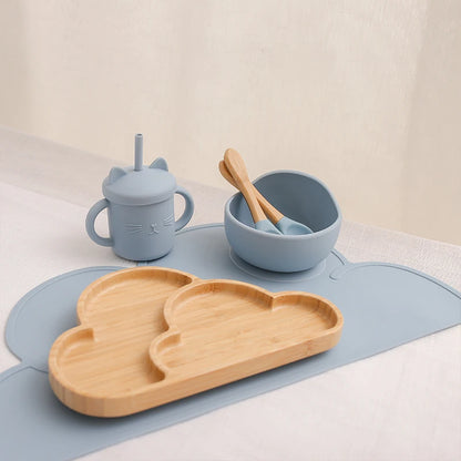 Eco-friendly Bubebaby Babylove 6-piece/7-piece Bamboo and Silicone Dinnerware Set for babies aged 6 months to 6 years. Made from BPA-free silicone and bamboo wood, this set includes a bowl, plate, fork, spoon, and teething toys, providing a safe and healthy mealtime experience. Certified by CE, EU, CIQ, and other standards for safety and quality