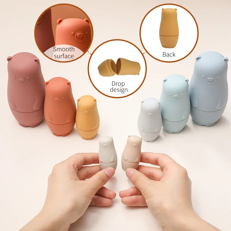 Montessori Silicone Bear Matryoshka Toy: A set of soft, stackable, bear-shaped nesting dolls in various sizes, made from pastel-colored, food-grade silicone. The bears fit inside one another, designed to encourage fine motor skills, sensory exploration, and cognitive development in young children