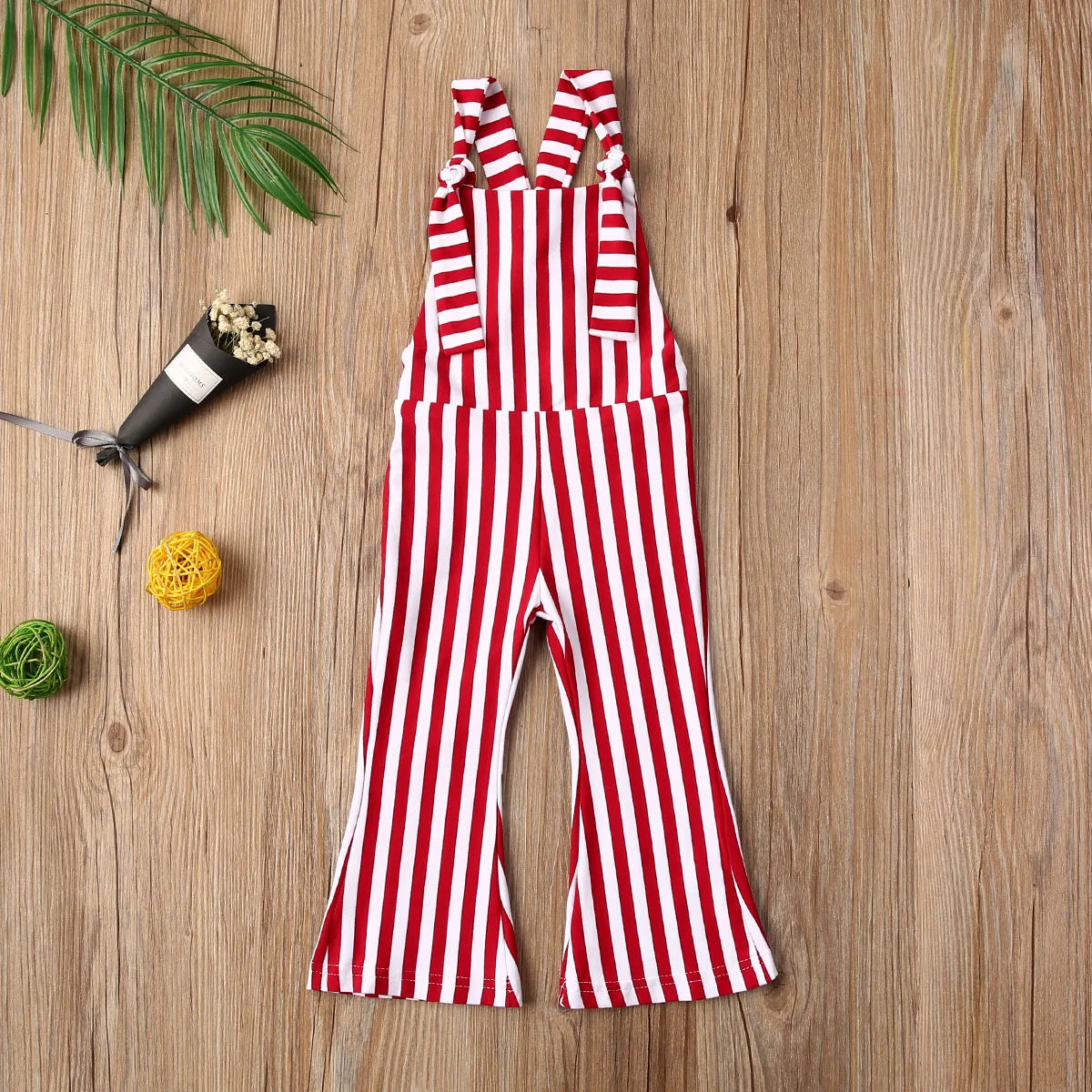 BabyLove Sleeveless Striped Romper at BubeBaby, perfect for baby girls from 0-5 years. Made from a comfy cotton-polyester blend, this versatile romper features a square collar, covered button closure, and short sleeves, ideal for all seasons. 