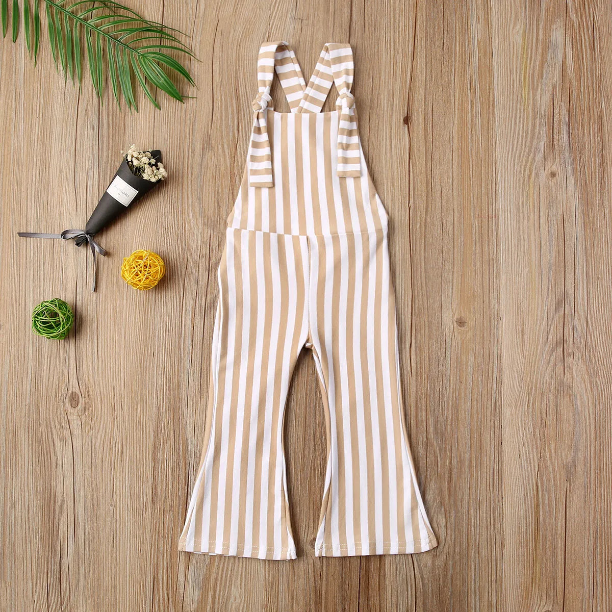 BabyLove Sleeveless Striped Romper at BubeBaby, perfect for baby girls from 0-5 years. Made from a comfy cotton-polyester blend, this versatile romper features a square collar, covered button closure, and short sleeves, ideal for all seasons. 