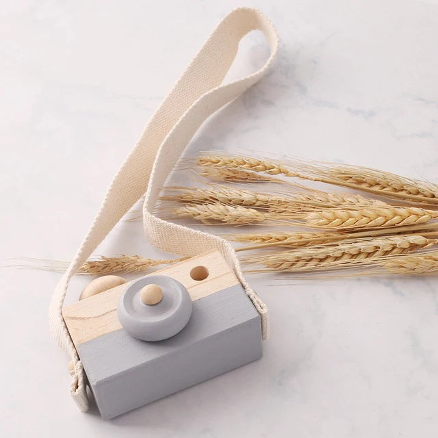 Babylove Wooden Vintage Camera in 8 colors, ideal for baby room decoration and play, designed with soft, textured surfaces for children aged 3-6 years. Unisex, CE certified, and Montessori-inspired