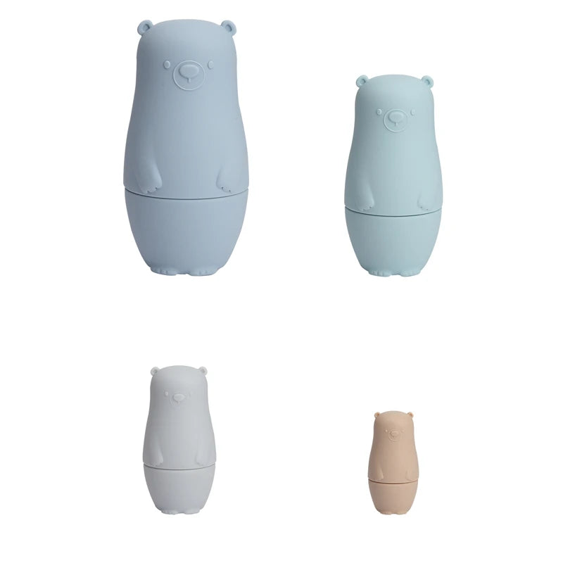 Montessori Silicone Bear Matryoshka Toy: A set of soft, stackable, bear-shaped nesting dolls in various sizes, made from pastel-colored, food-grade silicone. The bears fit inside one another, designed to encourage fine motor skills, sensory exploration, and cognitive development in young children