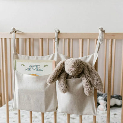 Discover BubeBaby's Nursery Crib Organizer, perfect for babies aged 0-1Y. Available in unisex colors (gray, pink, beige, navy blue), this versatile organizer comes in two styles: Canvas (29x49cm) and Muslin (20x39cm). Made from durable linen and ideal for year-round use, it keeps your nursery tidy and stylish