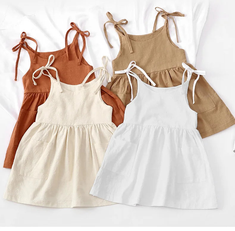 A BabyLove by Bubebaby light and breezy summer dress with spaghetti straps, designed for babies. The dress features a loose, relaxed fit and a soft, comfortable fabric, perfect for keeping little ones cool on warm days