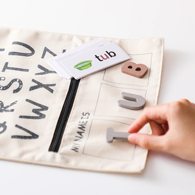 Child spelling the word tub with felt letters next to its picture card