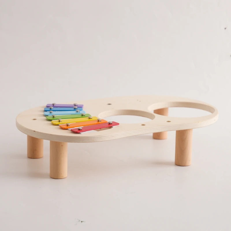 Discover the Bubebaby Montessori Music Table, an educational and non-electric musical instrument designed for children ages 0-14+. This table features engaging musical elements. Lightweight at 1.23kg and measuring 41.2X24.7X9.5cm, it's perfect for young learners seeking fun and educational play