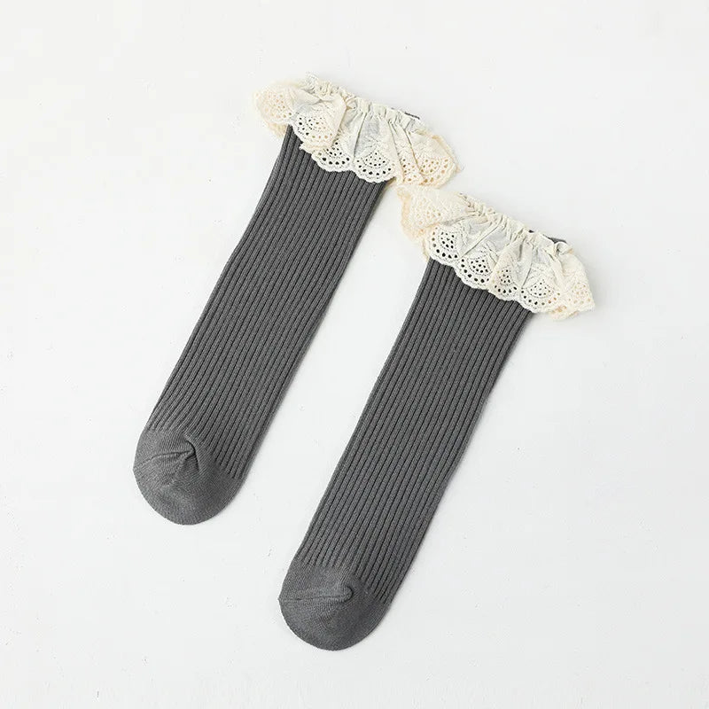 Bubebaby Babylove socks, perfect for all occasions. Made from cotton and polyester, these breathable comfortable, and skin-friendly socks are made with a solid pastoral style  featuring a ruffled frill finish