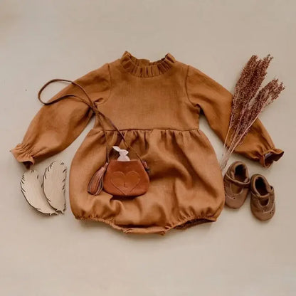 Bubebaby BabyLove Cotton Ruffled Long Sleeve buttoned Romper.  A cute and cozy baby romper made from soft cotton fabric, featuring long sleeves, a ruffled collar and wrists, with a snap closure for easy dressing. 