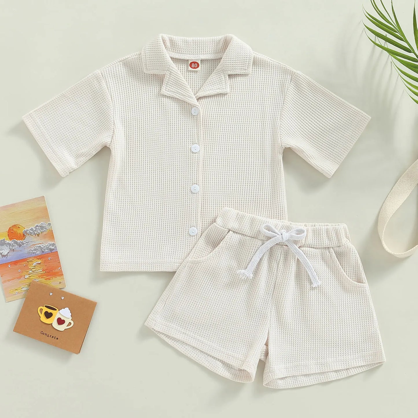 Shop our Bubebaby BabyLove summer baby unisex sets made from cotton and polyester, featuring a V-neck, single-breasted closure, and short sleeves. Available for ages 0-4 years with sizes ranging from 80-120 cm. The set includes a top and shorts with a cute print pattern, fitting true to size. Ideal for warm weather, these sets ensure comfort and style for your little ones.