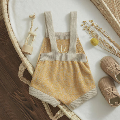  Baby unisex romper made from high-quality cotton and polyester, suitable for ages 0-24 months. The romper features a sleeveless design, straight collar, covered button closure, and a charming print pattern. Ideal for all seasons and available in various sizes to ensure a perfect fit.