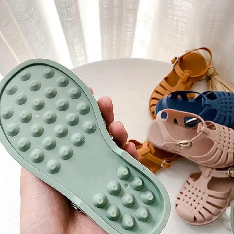 BabyLove Silicone Jelly Sandal at BubeBaby. These sandals feature a plastic outsole for durability and are designed with quick-dry, breathable, and anti-slippery features. Available in lengths of 10cm, 10.5cm, and 11cm, perfect for active little feet. Shop now for comfort and style