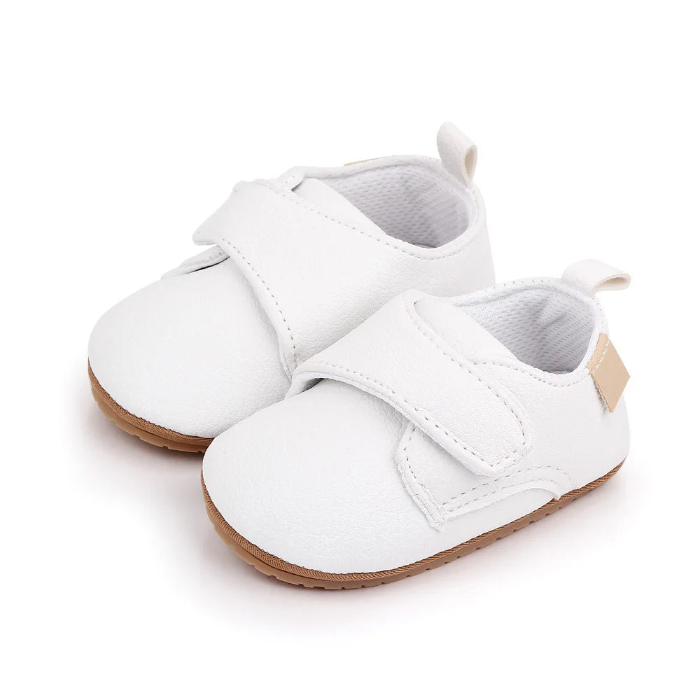 Bubebaby BabyLove faux leather dress shoes in a classic look. The shoes feature a sleek, polished design perfect for special occasions or formal wear. With a soft, cushioned interior for comfort