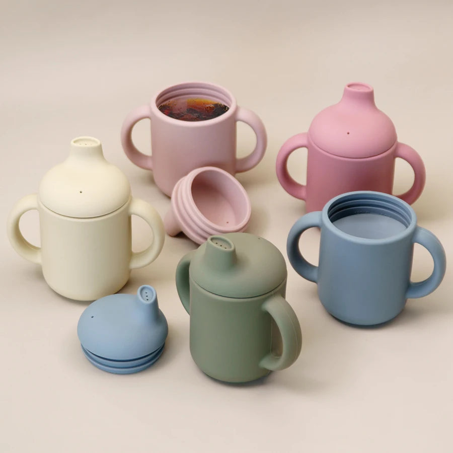 Silicone sippy cups with handles in five colours, lids on and off