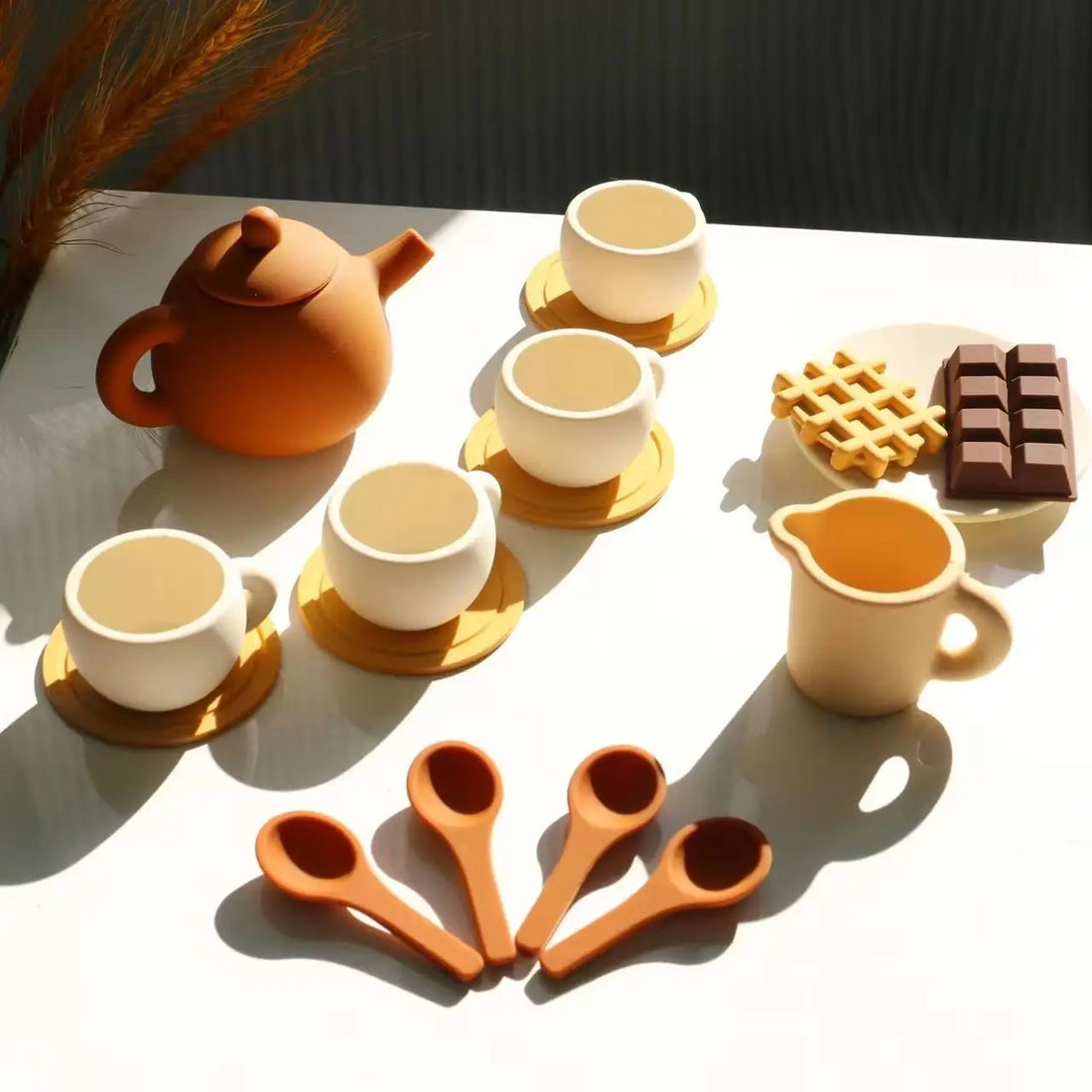 Silicone tea set with teapot, cups, saucers, spoons, milk jug and pretend sweets