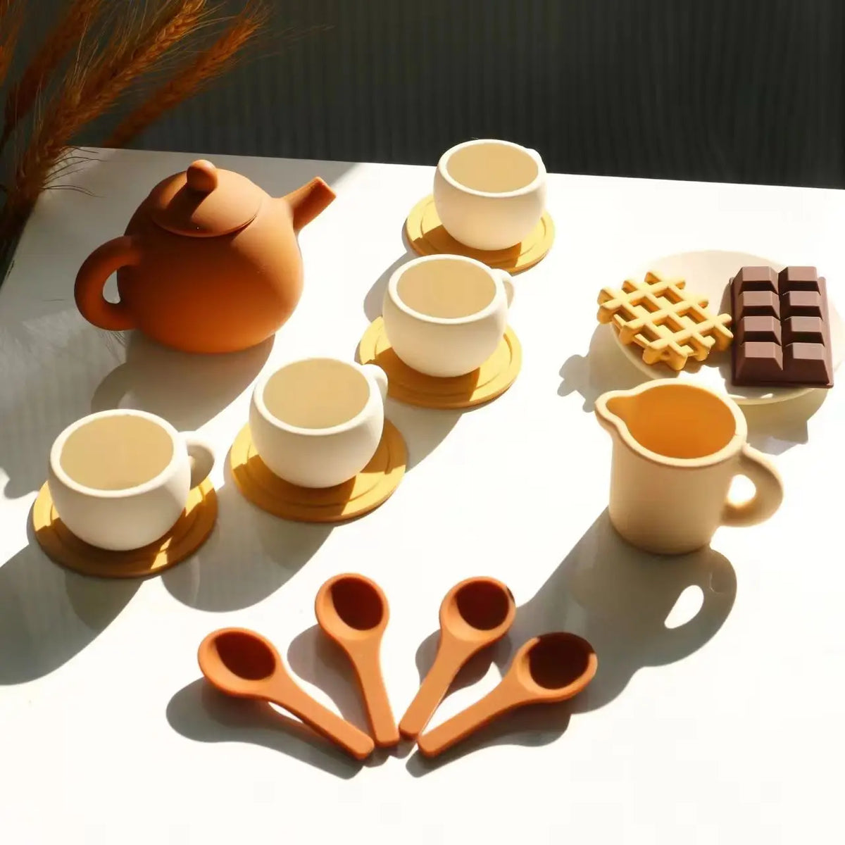Silicone tea set with teapot, cups, saucers, spoons, milk jug and pretend sweets