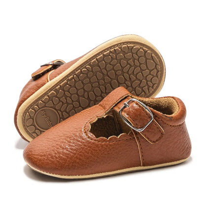 Bubebaby BabyLove faux leather dress shoes in a classic look. The shoes feature a sleek, polished design perfect for special occasions or formal wear. With a soft, cushioned interior for comfort