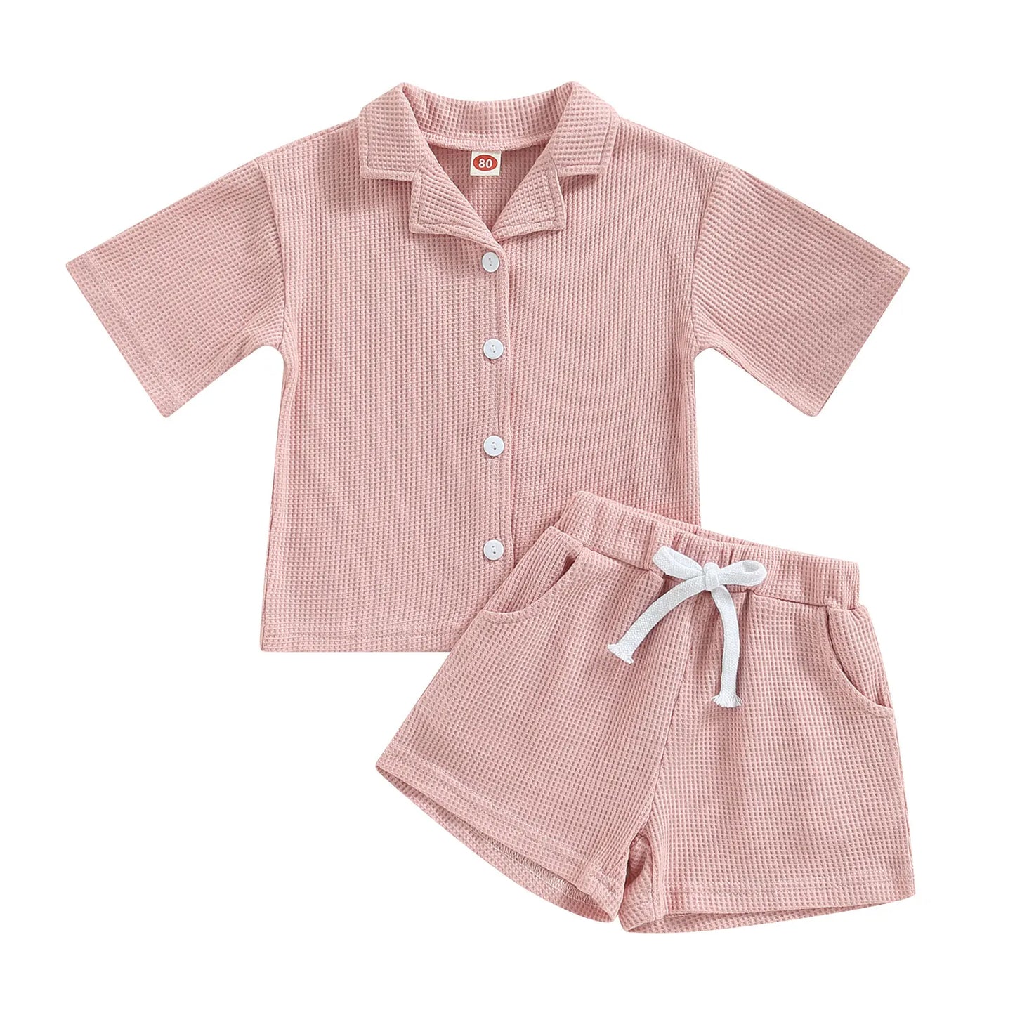 Shop our Bubebaby BabyLove summer baby unisex sets made from cotton and polyester, featuring a V-neck, single-breasted closure, and short sleeves. Available for ages 0-4 years with sizes ranging from 80-120 cm. The set includes a top and shorts with a cute print pattern, fitting true to size. Ideal for warm weather, these sets ensure comfort and style for your little ones.