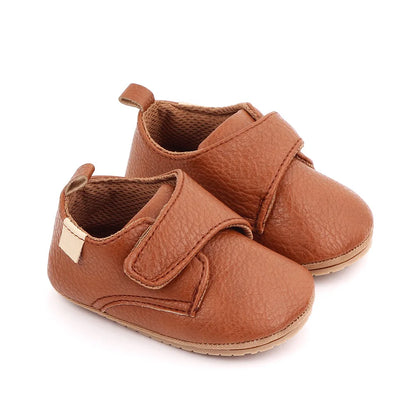 Bubebaby BabyLove faux leather dress shoes in a classic look. The shoes feature a sleek, polished design perfect for special occasions or formal wear. With a soft, cushioned interior for comfort