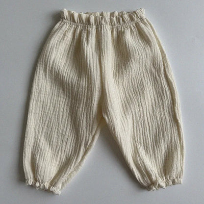 Soft muslin pants for babies from the BabyLove by Bubebaby collection. The pants are made of lightweight, breathable fabric with a gentle, stretchy waistband and a relaxed fit for comfort. The color is a soft, neutral tone, suitable for pairing with various baby tops