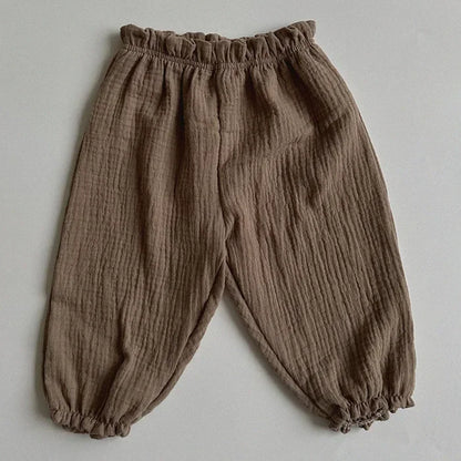 Soft muslin pants for babies from the BabyLove by Bubebaby collection. The pants are made of lightweight, breathable fabric with a gentle, stretchy waistband and a relaxed fit for comfort. The color is a soft, neutral tone, suitable for pairing with various baby tops