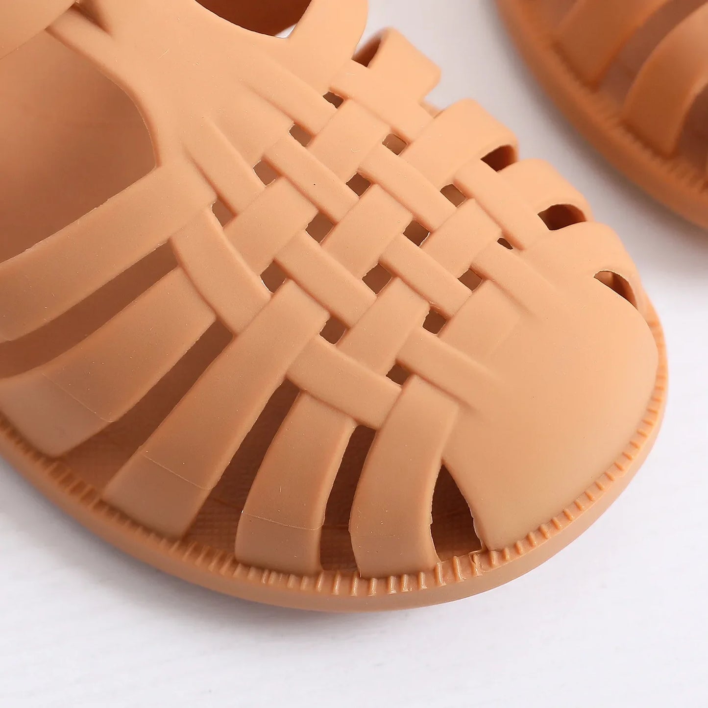 BabyLove Silicone Jelly Sandal at BubeBaby. These sandals feature a plastic outsole for durability and are designed with quick-dry, breathable, and anti-slippery features. Available in lengths of 10cm, 10.5cm, and 11cm, perfect for active little feet. Shop now for comfort and style